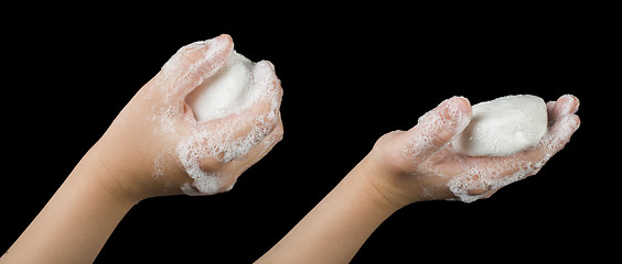 Image showing Lathered hands and soap