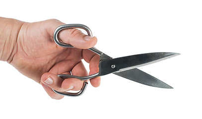 Image showing Hand and metal scissors