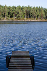 Image showing Detail of jetty in calm water