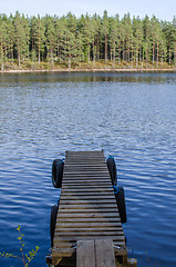 Image showing Old jetty at calm lake