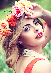 Image showing beautiful woman with roses outdoor summertime