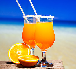 Image showing Tequila Sunrise Cocktail on wooden planks