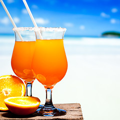 Image showing Tequila Sunrise Cocktail on wooden planks