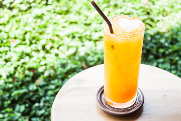 Image showing A glass of fresh iced orange juice