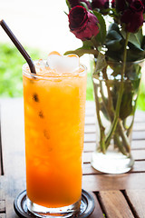 Image showing Fresh iced orange juice in home garden