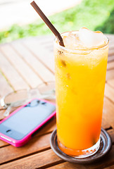 Image showing Summer fresh time with orange juice and straw