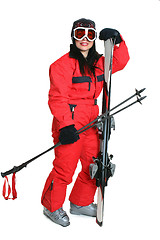 Image showing Female skier in red ski suit