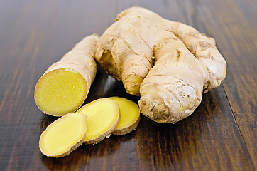 Image showing Ginger root cut into the dark board