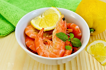 Image showing Shrimp in a white bowl with lemon slices