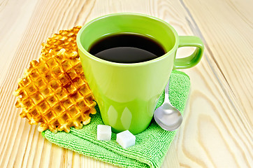 Image showing Wafers are round with a green mug and sugar