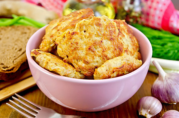Image showing Fritters chicken in a pink bowl on the board