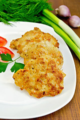 Image showing Fritters chicken with vegetables on the board