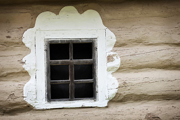 Image showing Window of ancient Ukrainian hut. Clay covered wall