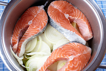 Image showing raw salmon and onions in pot