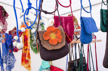 Image showing felt wool girl bag sold outdoor street market fair 