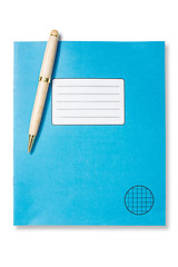 Image showing Blue exercise book and pen