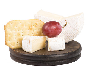 Image showing cheeses on the wooden board