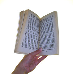 Image showing Holding a book open