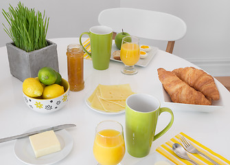 Image showing Bright table setting with tasty breakfast