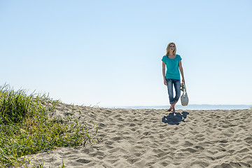 Image showing Young Woman Standing On Beach