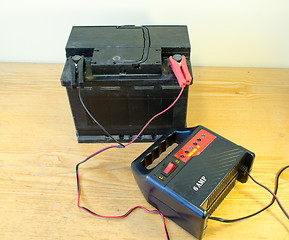 Image showing auto battery charger clamps connect accumulator 