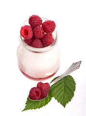 Image showing Fresh Yogurt in a jar with Raspberries, leaves