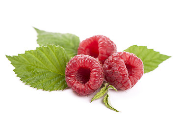 Image showing Ripe raspberry with green leaf