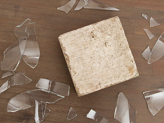 Image showing Brick with broken glass, violence concept