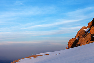 Image showing Hiker in sunrise mountains