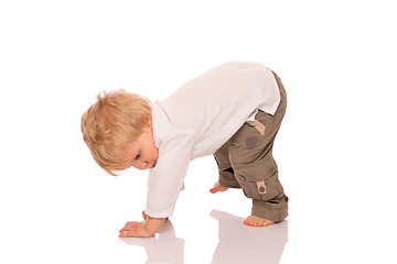 Image showing Young boy learning to walk