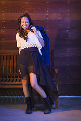 Image showing Mixed Race Young Adult Woman Portrait Against Wooden Wall