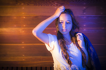 Image showing Mixed Race Young Adult Woman Portrait Against Wooden Wall