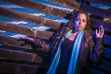 Image showing Frightened Pretty Young Woman in Dark Walkway at Night