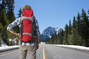 Image showing Backpacker on mountain road