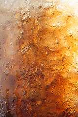 Image showing Gradient of fizzy ice cola in a glass 