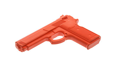 Image showing Dirty red training gun isolated on white