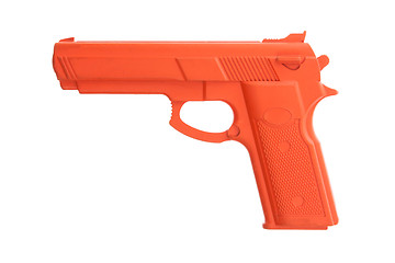 Image showing Dirty red training gun isolated on white