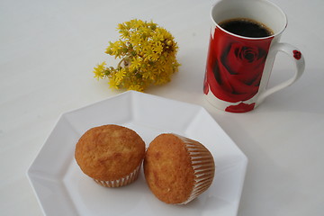 Image showing Madalenas with coffee and Spanish flower