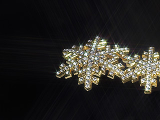 Image showing shiny jewellery in dark back