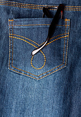 Image showing Eyeglasses in back pocket of jeans