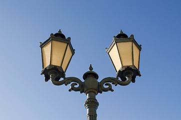 Image showing iron lighting pole twin lamp background blue sky 