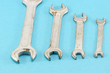 Image showing set size hand wrench screw tools on blue 