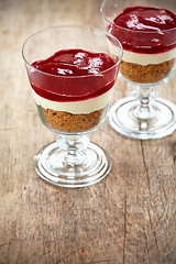 Image showing Dessert with cream and cranberry sauce