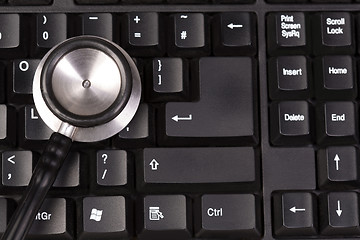 Image showing Stethoscope on keyboard, closeup shot