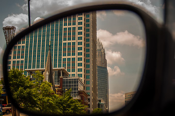 Image showing buildings seen in side mirror