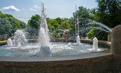 Image showing Detail of an old classic style stone fountain with flowing water