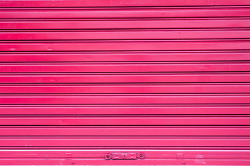 Image showing Red roller metal door surface of apartment