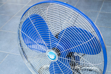 Image showing Front of industrial fan on blue floor