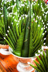 Image showing Handicraft banana leaf rice offering in metal tray