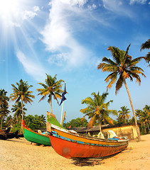 Image showing old fishing boats on beach in india
